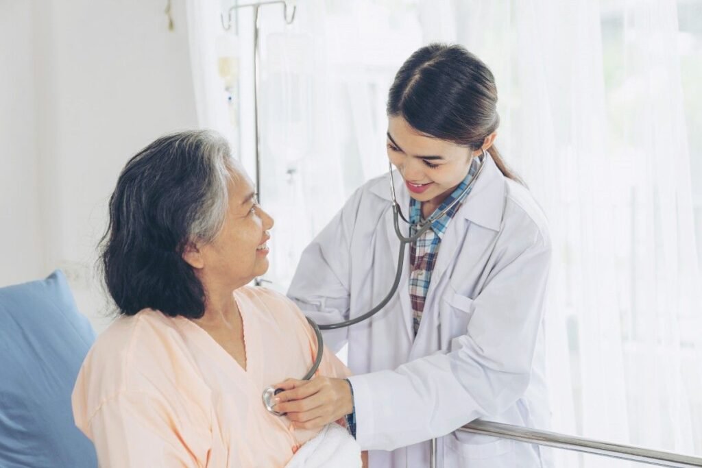 Cardiac checkup in Thrissur with a doctor performing a routine heart examination on a patient during a preventive cardiovascular health assessment.